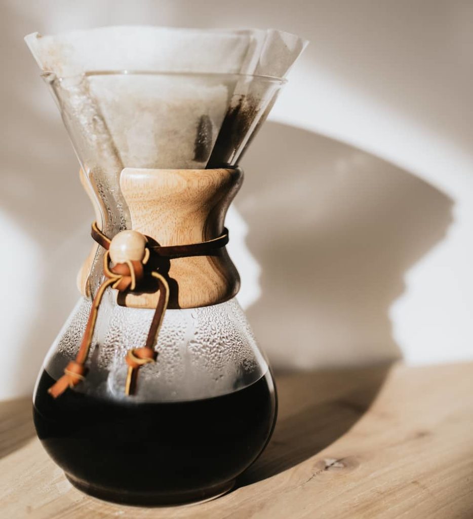 large chemex with freshly brewed coffee in base
