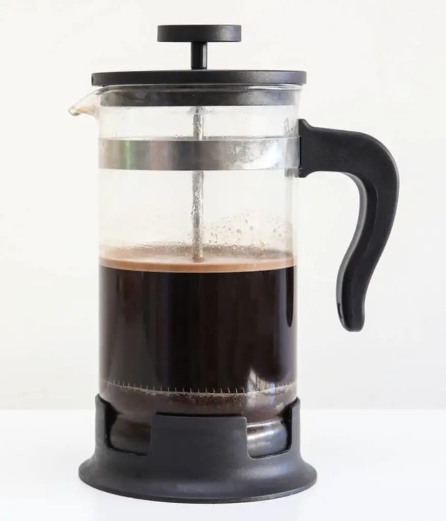 french press half filled with coffee