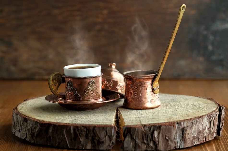 traditional turkish coffee brewer with cup