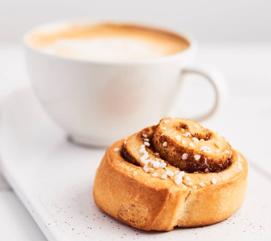 A cup of coffee and a Swedish cinnamon bun