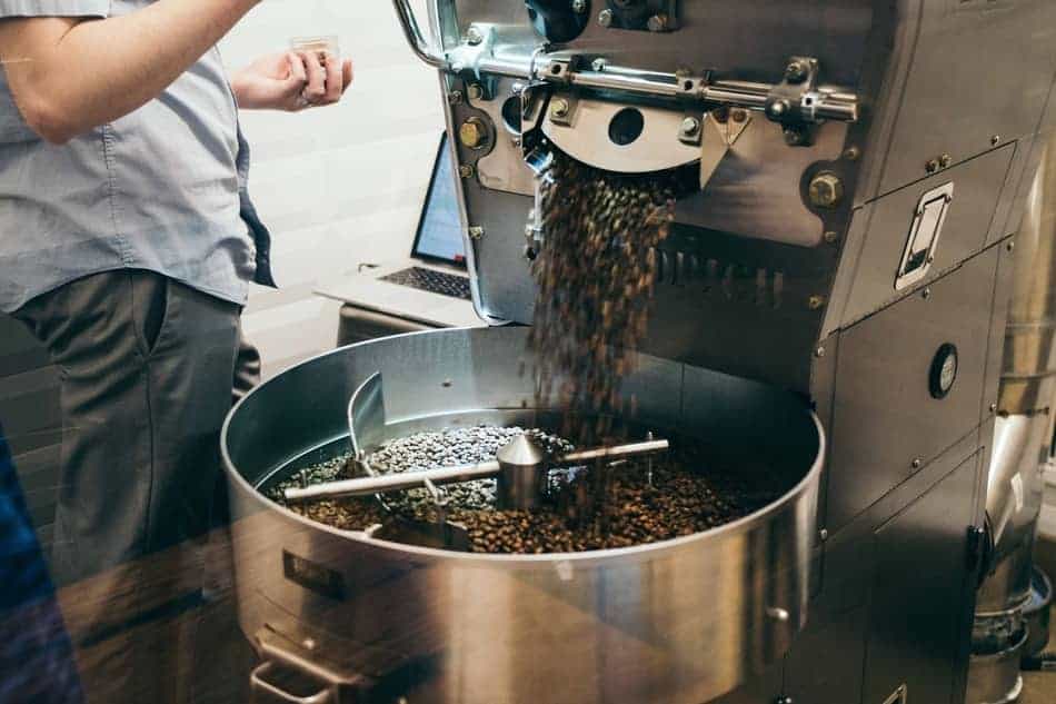 Roasting releasing freshly roasted coffee beans for rapid cooling