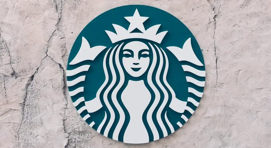 starbucks logo on a stone wall